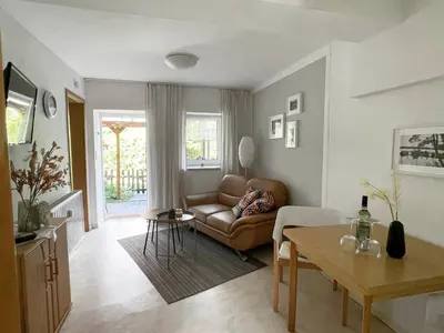 Ein Sitzbereich in der Unterkunft Gemütliche Wohnung Landlust in See-Nähe