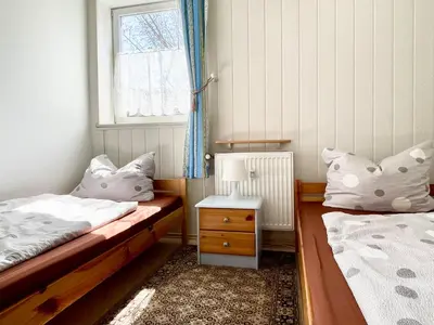 Ein Bett oder Betten in einem Zimmer der Unterkunft Ferienwohnung ‘Storchennest’