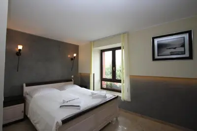 Ein Bett oder Betten in einem Zimmer der Unterkunft Hotel Da Gianni GmbH