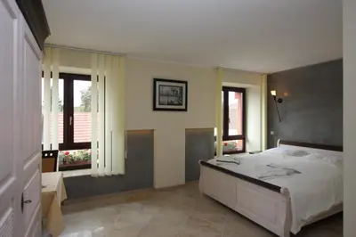 Ein Bett oder Betten in einem Zimmer der Unterkunft Hotel Da Gianni GmbH