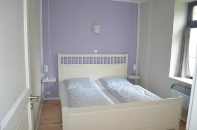 Ein Bett oder Betten in einem Zimmer der Unterkunft Wassersportzentrum Alte Feuerwache