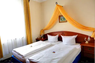 Ein Bett oder Betten in einem Zimmer der Unterkunft Schloss Zehdenick