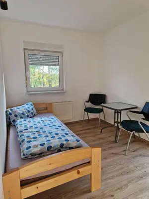 Ein Bett oder Betten in einem Zimmer der Unterkunft Fewo für Monteure 25km bis Berlin