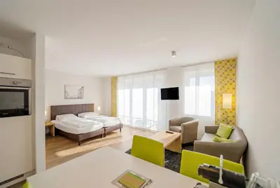 Ein Bett oder Betten in einem Zimmer der Unterkunft ADAPT APARTMENT HOTEL BERLIN - Adlershof