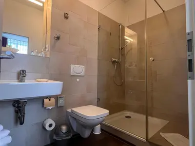 Ein Badezimmer in der Unterkunft Apartmenthaus Gutenberg 78