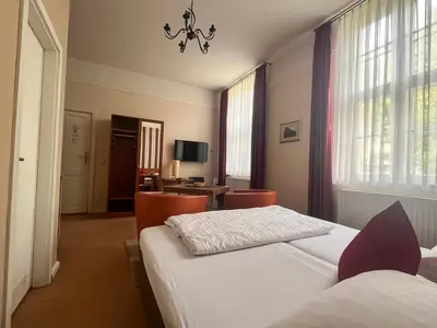Ein Bett oder Betten in einem Zimmer der Unterkunft Apartmenthaus Gutenberg 78