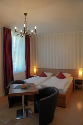 Ein Bett oder Betten in einem Zimmer der Unterkunft Apartmenthaus Gutenberg 78