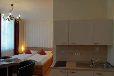 Ein Bett oder Betten in einem Zimmer der Unterkunft Apartmenthaus Gutenberg 78