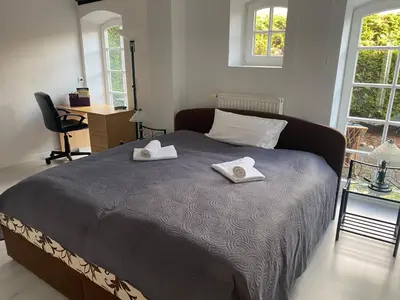 Ein Bett oder Betten in einem Zimmer der Unterkunft Ferienwohnungen Sieversdorf