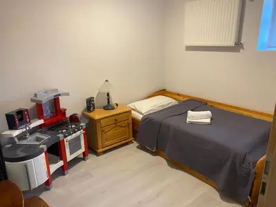 Ein Bett oder Betten in einem Zimmer der Unterkunft Ferienwohnungen Sieversdorf