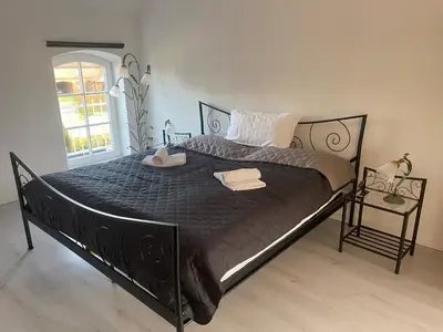 Ein Bett oder Betten in einem Zimmer der Unterkunft Ferienwohnungen Sieversdorf
