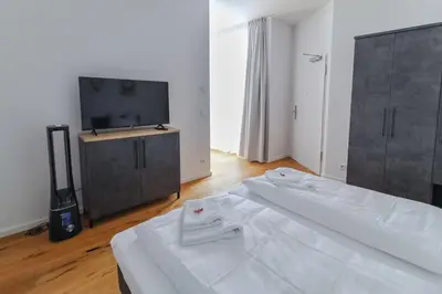 Ein Bett oder Betten in einem Zimmer der Unterkunft Helios Berlin Apartments