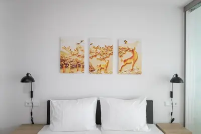 Ein Bett oder Betten in einem Zimmer der Unterkunft Helios Berlin Apartments