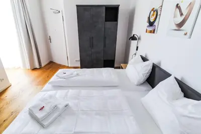 Ein Bett oder Betten in einem Zimmer der Unterkunft Helios Berlin Apartments