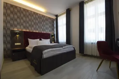 Ein Bett oder Betten in einem Zimmer der Unterkunft Hotel Grand Inn Berlin - Weißensee