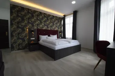 Ein Bett oder Betten in einem Zimmer der Unterkunft Hotel Grand Inn Berlin - Weißensee