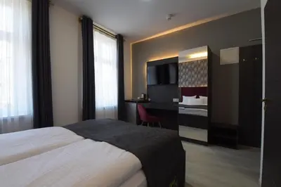 Ein Bett oder Betten in einem Zimmer der Unterkunft Hotel Grand Inn Berlin - Weißensee