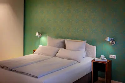 Ein Bett oder Betten in einem Zimmer der Unterkunft TempelCasa Kreuzberg