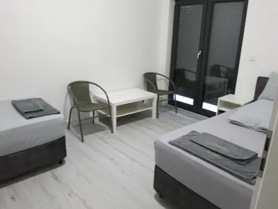Ein Bett oder Betten in einem Zimmer der Unterkunft Elvano Apartments