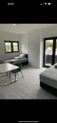 Ein Bett oder Betten in einem Zimmer der Unterkunft Elvano Apartments