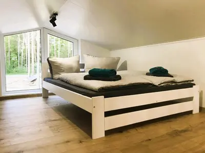 Ein Bett oder Betten in einem Zimmer der Unterkunft Ferienhaus am Briesensee