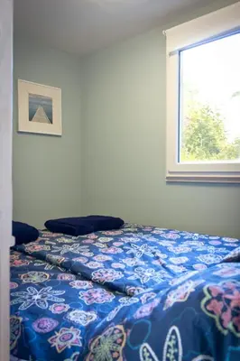 Ein Bett oder Betten in einem Zimmer der Unterkunft Bungalow mit Wintergarten