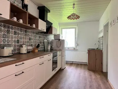 Küche/Küchenzeile in der Unterkunft Ferienhaus im Wald, am Briesener See
