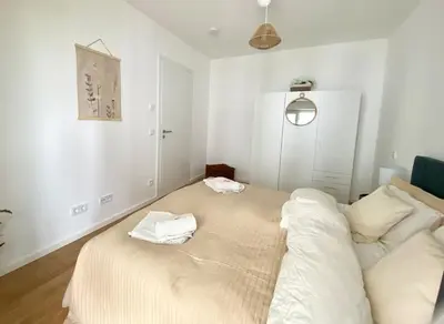 Ein Bett oder Betten in einem Zimmer der Unterkunft Apartment am Flughafen, Glasfaser-Internet, Waschmaschine