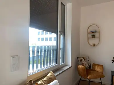 Ein Sitzbereich in der Unterkunft Apartment am Flughafen, Glasfaser-Internet, Waschmaschine