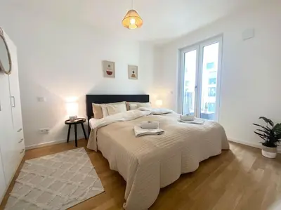 Ein Bett oder Betten in einem Zimmer der Unterkunft Apartment am Flughafen, Glasfaser-Internet, Waschmaschine