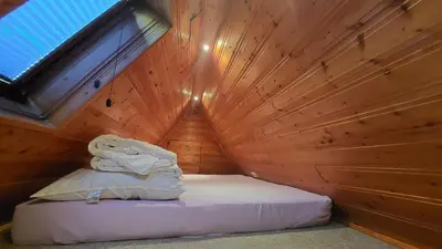 Ein Bett oder Betten in einem Zimmer der Unterkunft Ferienwohnung zum Holzwurm