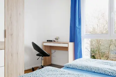 Ein Bett oder Betten in einem Zimmer der Unterkunft In 20-30 Minuten im Zentrum
