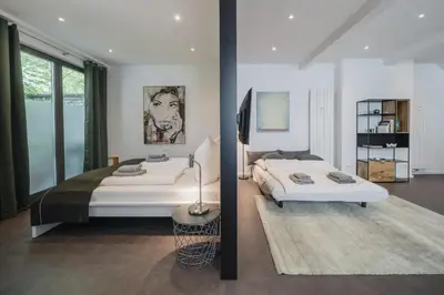 Ein Bett oder Betten in einem Zimmer der Unterkunft Homely Berlin - Luxury Loft, Modern, Near Kurfürstendamm I Cafe