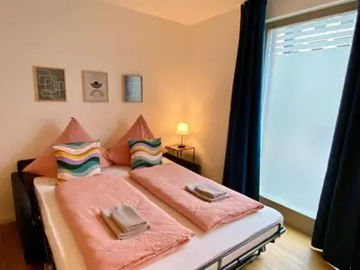 Ein Bett oder Betten in einem Zimmer der Unterkunft Apartments am Lutherplatz