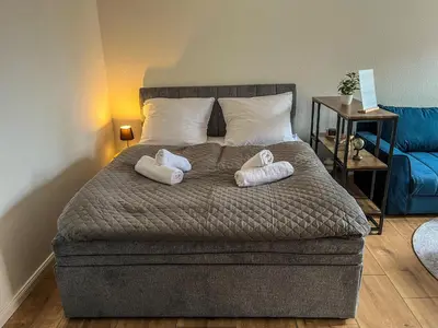 Ein Bett oder Betten in einem Zimmer der Unterkunft Apartment für 2 mit Balkon