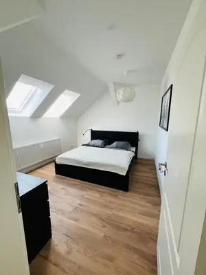 Ein Bett oder Betten in einem Zimmer der Unterkunft Gutshof von Gemünden Ferienwohnung 1