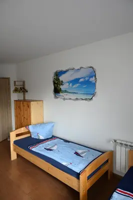 Ein Bett oder Betten in einem Zimmer der Unterkunft Monteure sind HERZLICH WILLKOMMEN!