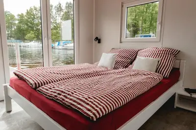 Ein Bett oder Betten in einem Zimmer der Unterkunft Haus auf dem See Elise, Matheo, Mads, und Jarle