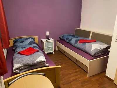 Ein Bett oder Betten in einem Zimmer der Unterkunft Pension am Bahnhof