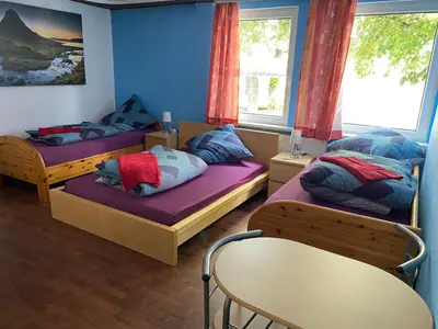 Ein Bett oder Betten in einem Zimmer der Unterkunft Pension am Bahnhof