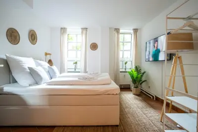 Ein Bett oder Betten in einem Zimmer der Unterkunft Charmantes 2-Zimmer-Apartment mit Vorgarten