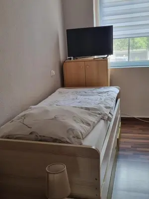 Ein Bett oder Betten in einem Zimmer der Unterkunft Ferienwohnung am Kanuverleih