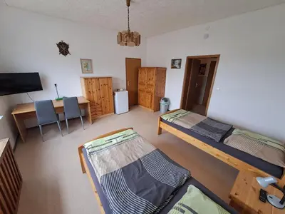 Ein Bett oder Betten in einem Zimmer der Unterkunft Ingos Landhaus