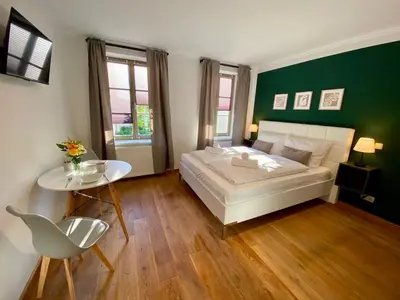 Ein Bett oder Betten in einem Zimmer der Unterkunft Apartments am Markt