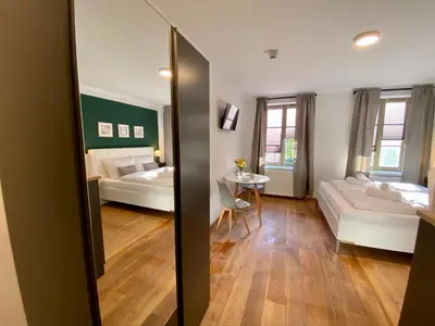 Ein Bett oder Betten in einem Zimmer der Unterkunft Apartments am Markt