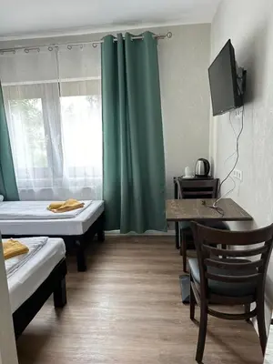 Ein Bett oder Betten in einem Zimmer der Unterkunft Hotel Pirol