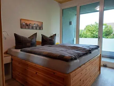Ein Bett oder Betten in einem Zimmer der Unterkunft Moderne Ferienwohnung in Berlin Mahlsdorf