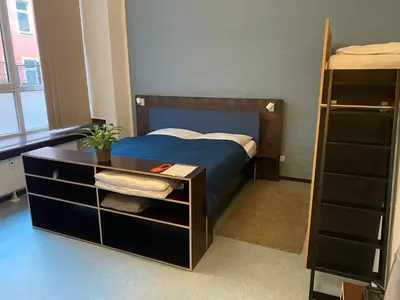 Ein Bett oder Betten in einem Zimmer der Unterkunft Hüttenpalast