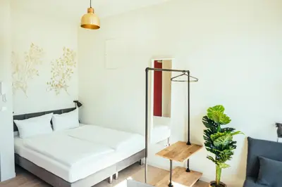 Ein Bett oder Betten in einem Zimmer der Unterkunft The Rix Studios & Suites