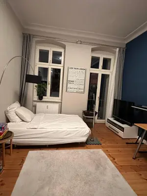 Ein Bett oder Betten in einem Zimmer der Unterkunft Große Stadtwohnung direkt am Mauerpark